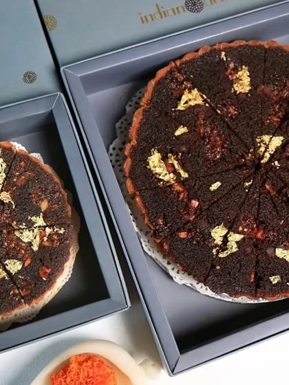 Our doda burfi treacle tart, adorned with gold leaf and elegantly packaged for our Diwali dessert gift boxes. It’s a rich, decadent treat perfect for celebrations.