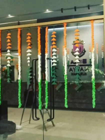 The entrance to the office was decorated with hanging garlands made of artificial flowers in the tricolour theme, creating a welcoming and patriotic first impression for employees and visitors on Independence Day.