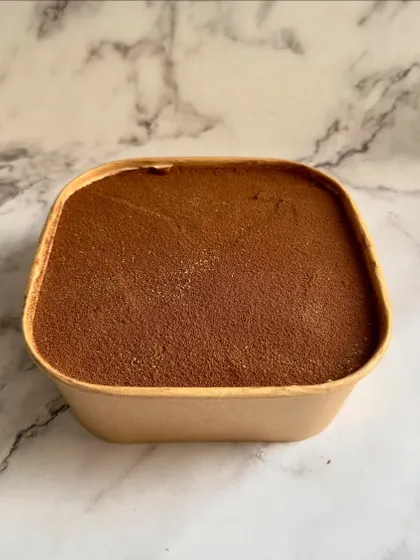 This is my Tiramisu, available in a convenient tub. It's an authentic Italian delight with layers of coffee-soaked ladyfingers and creamy mascarpone with a hint of rum.