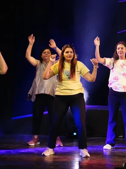 Our ladies' Zumba group, smiling and grooving together on stage. This performance was a true celebration of fitness and friendship.
