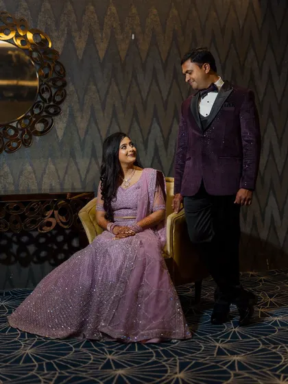 An elegant, posed portrait of a couple at their reception. We use the sophisticated interiors of the venue to create timeless and glamorous photographs.