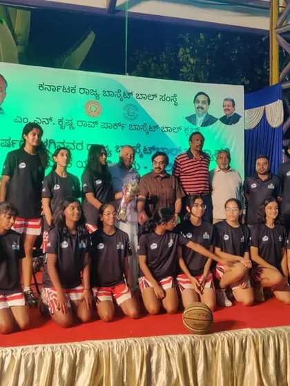 The U16 girls team on stage at the State Championship, a valuable experience competing against the best in Karnataka.