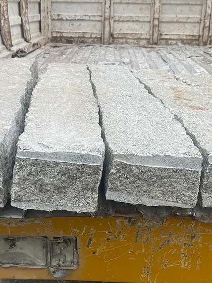 Rough stone pillars loaded and ready for delivery.