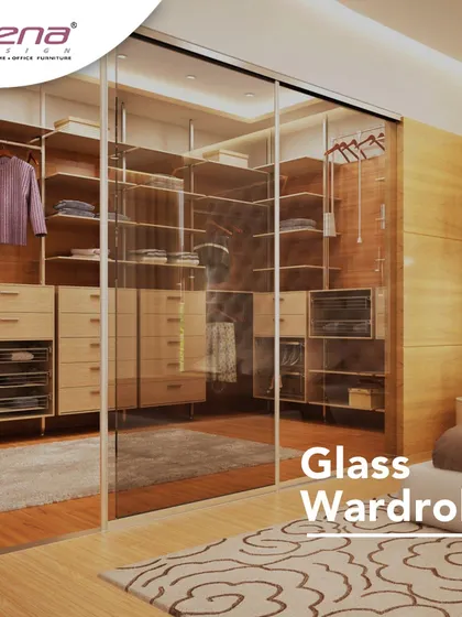 A glass wardrobe creates a boutique-like feel in your bedroom. This design uses clear glass sliding doors to showcase your collection while keeping it dust-free.