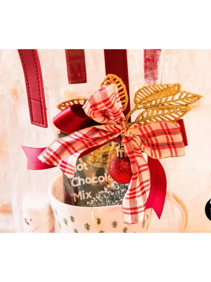 Our 'Hug in a Mug' Christmas gift, beautifully packaged in a clear tote bag with a festive ribbon.