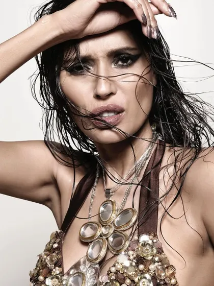 The incredible Ujjwala Raut. This portrait is all about raw, untamed beauty. The wet hair, intense gaze, and dramatic lighting come together to create a powerful and high-fashion statement.