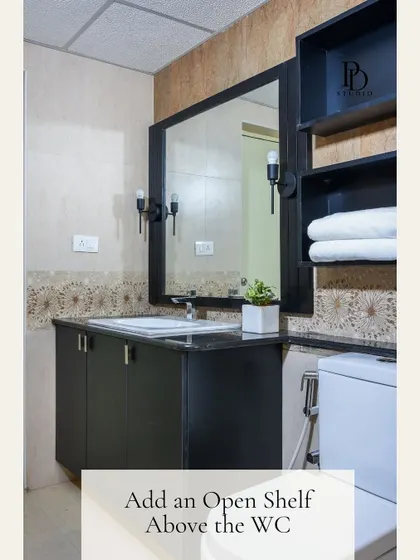 Adding an open shelf above the toilet is a smart hack for gaining storage in a small bathroom. It’s the perfect spot for storing extra towels or adding a touch of green with a small plant.