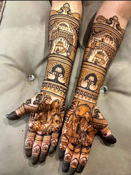 This elegant design showcases a wedding ceremony on the palms, with graceful swan and lotus motifs on the forearms, topped with palace domes.