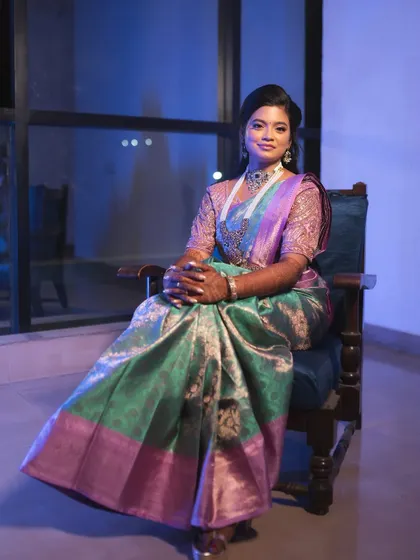 A full portrait of the bride, looking regal and elegant in her reception attire.