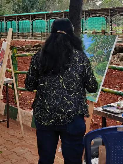 A view from the back, showing me completely absorbed in my work at Lalbagh.