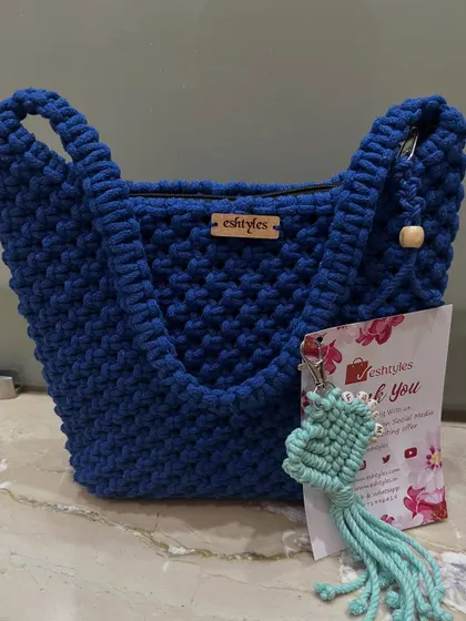 A vibrant royal blue shoulder bag, complete with a thank you card and a complimentary keychain. I love adding a little surprise to every order.