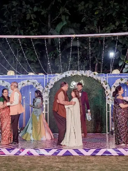 Multiple couples from the family dancing together on stage. This is a wonderful way to showcase the love and relationships within the family.