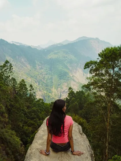 A moment of solitude overlooking the vast green valleys of Kodaikanal. Our trips offer the perfect balance of group fun and personal time to connect with nature.