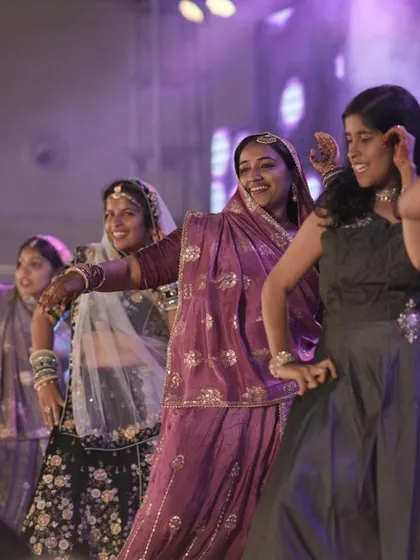 A group of friends performing a traditional Rajasthani folk-inspired dance. We can choreograph a wide variety of styles, from Bollywood to folk, to match the theme of your wedding.