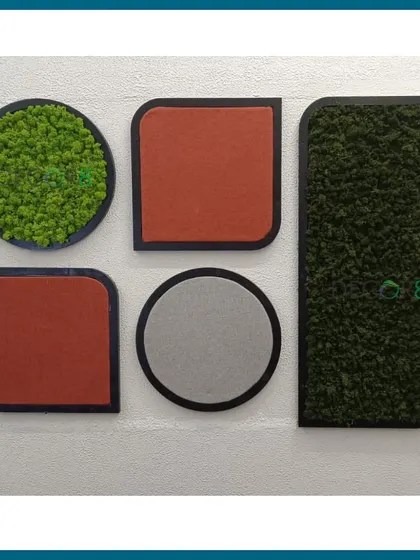 Moss can be combined with other materials like acoustic felt panels to create functional art. This installation uses circular and rectangular shapes with different textures and colors for a playful yet sophisticated wall feature that also helps with sound dampening.