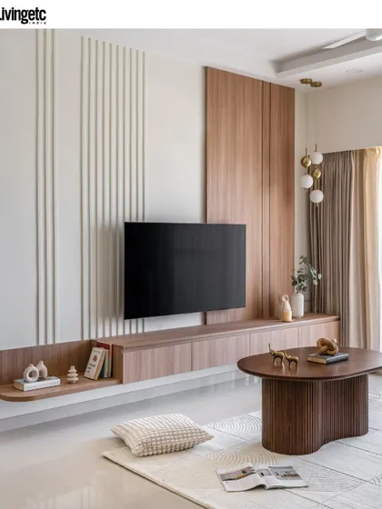 A look at the custom TV unit from my Livingetc-featured project. I combined wood paneling with vertical grooves to create a feature wall that is both a storage solution and a piece of architectural art.
