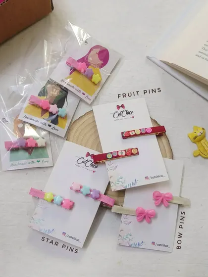 Just in time for the holidays! A collection of our trendy hair pins, including star pins, fruit pins, and bow pins.