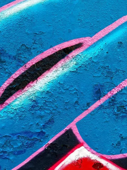 A detailed close-up of the lettering in the Shiva mural. The Devanagari script is written in a fluid, graffiti-inspired style.