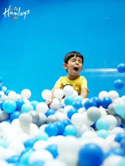 This is the look of pure happiness! Diving into a giant ball pit is a classic part of the fun I offer, perfect for kids to jump, hide, and play in a safe, cushioned environment.
