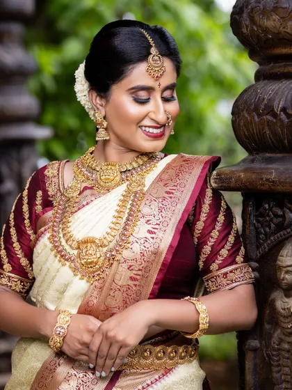 A close-up of the bride's serene expression, with the focus on the beautiful Lakshmi haaram and choker.