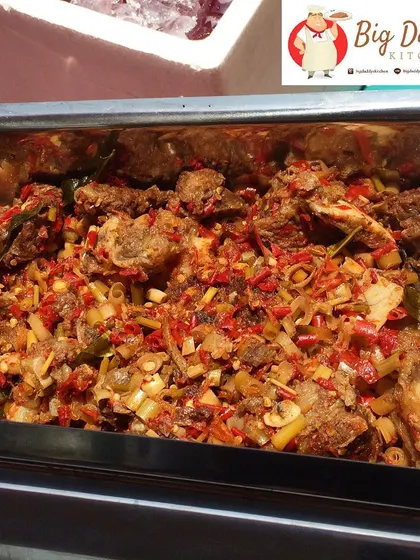 Meet our Iga Pedas, or Lightning Ribs! They are super spicy and full of flavor. We cook them all day in a big pot right at our stall.