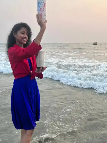 Our flair girl practicing a move by the sea. We combine artistry with a love for what we do.