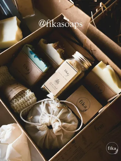 Here is another one of my unique, curated gift sets. This box features a selection of artisan soaps, a soap saver pouch, bath salts, and other small-batch items, all nestled in kraft paper shred for sustainable and beautiful presentation.