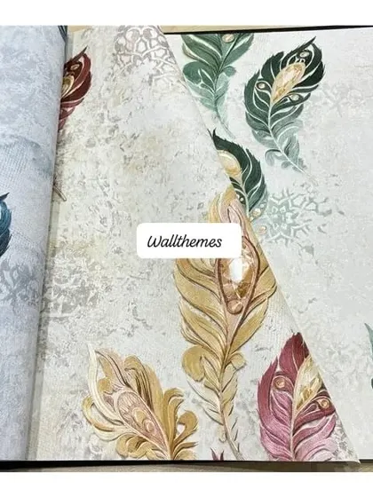 A close-up of several wallpaper samples with different colored peacock feather designs.