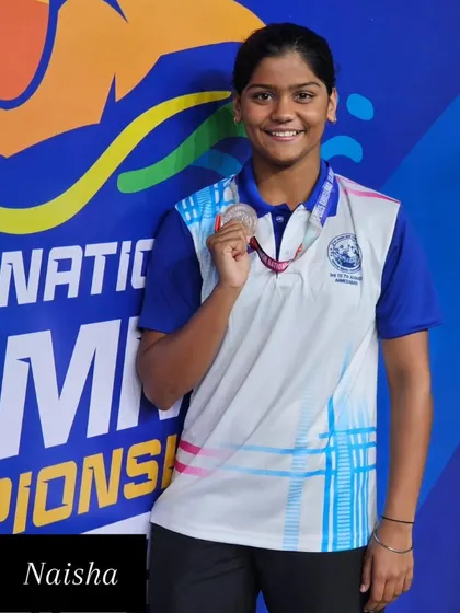 Naisha with her silver medal in the 200m Backstroke.