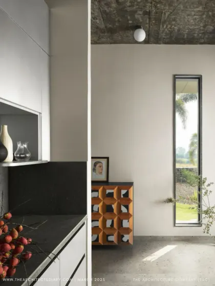 A detail shot of the kitchen and a narrow view window at Pavilion House, as featured in The Architect's Diary.