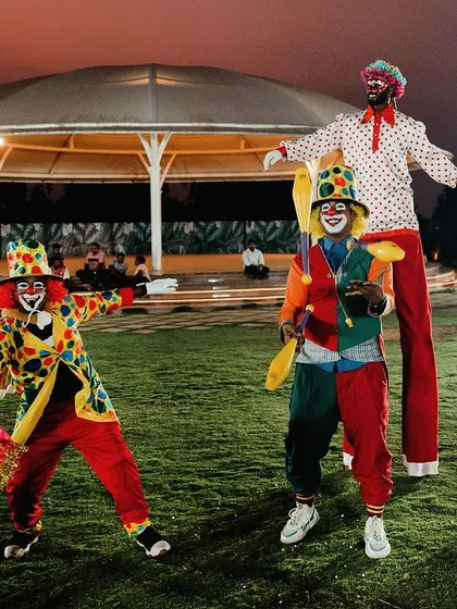 Entertainment is key to a great party! I can arrange for professional performers like these colorful clowns and stilt walkers to interact with guests and create a lively atmosphere.