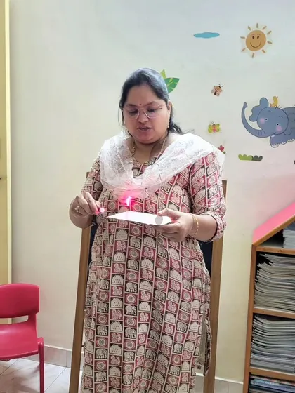 I'm demonstrating how a laser beam can be bent and reflected. Understanding the properties of light is fundamental to many technologies, from fiber optics to cameras.