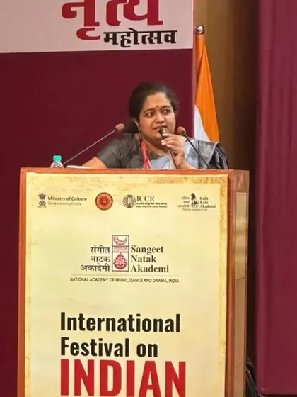 Speaking at the podium, sharing my research and passion for folk arts with a global audience.