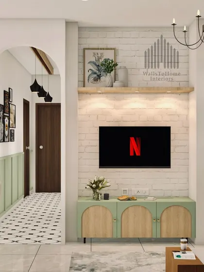 This living room features a rustic-chic TV unit against a white brick wall, with an arched entryway leading to a hallway with patterned tiles. The design blends different textures and styles for a unique look.