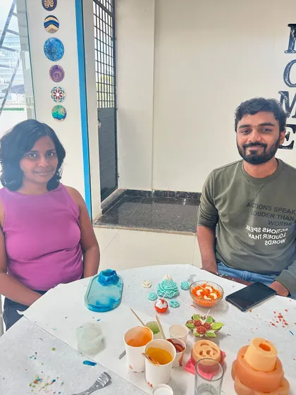 A couple working on their candle creations. We offer a variety of molds and scents to choose from.