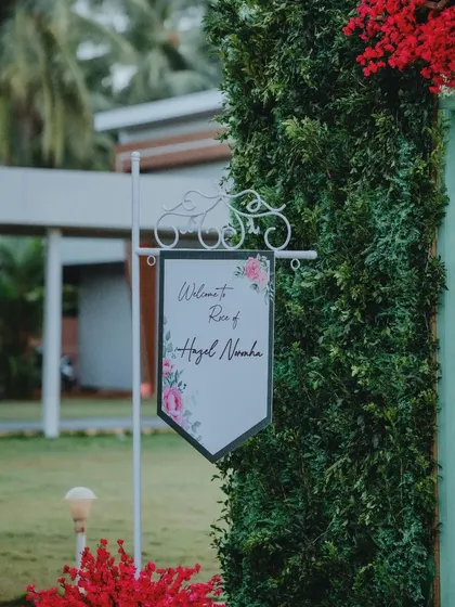 A charming welcome sign for a Roce ceremony. The elegant floral design and classic wrought-iron stand create a sweet and inviting entrance for guests.