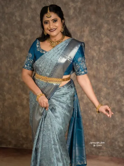 A full-length view of the stunning silver-blue saree and my custom blouse design. It's a perfect example of how a well-matched blouse can complete a look.