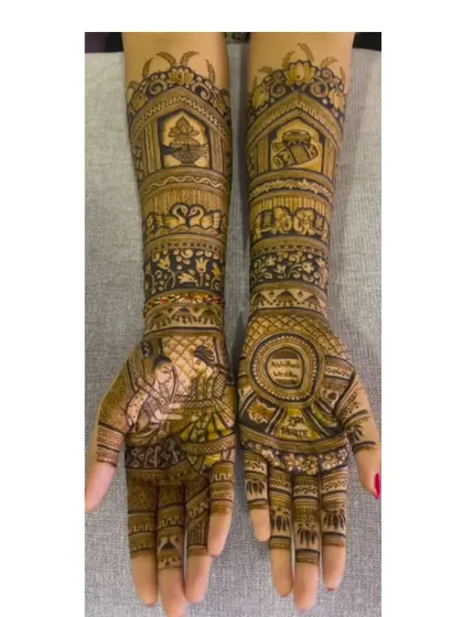 This design features a scene of a couple performing a ritual, adding a personal and meaningful touch to the bridal mehendi.