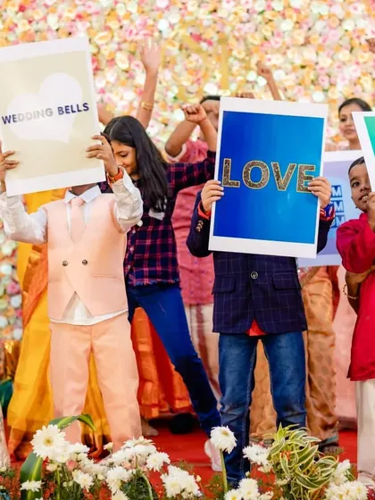 Another shot of the guests holding up signs, creating a beautiful photo opportunity and a wave of love for the couple.