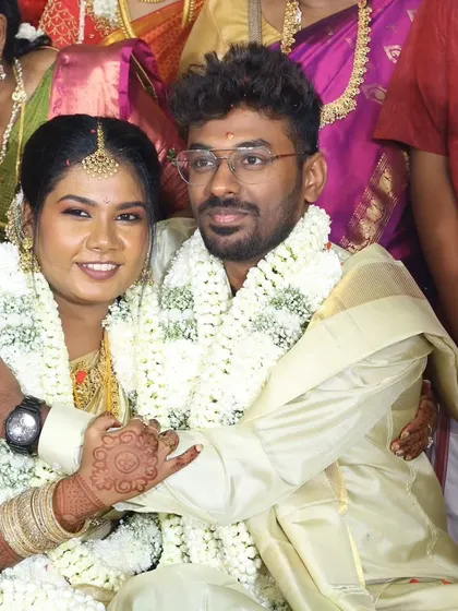 Another happy couple during their wedding ceremony. The groom's fresh look lasts through all the rituals and celebrations.