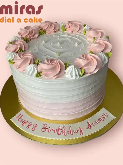 A beautiful pink and white ombre cake decorated with delicate pink roses. This is a classic and feminine design perfect for a birthday celebration.