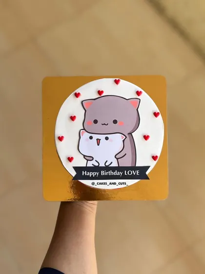 A sweet "Happy Birthday Love" cake with an adorable cat couple illustration.