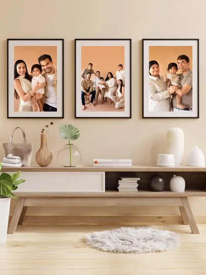 Another example of a stunning gallery wall, showcasing a variety of family portraits from a single session.