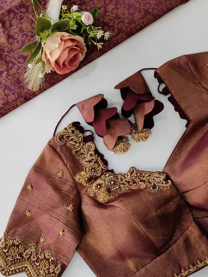 Another view of this gorgeous brown blouse, showing the sleeve detail and the unique fabric tassels. I work closely with my clients to create these special touches that make their outfit truly one of a kind.