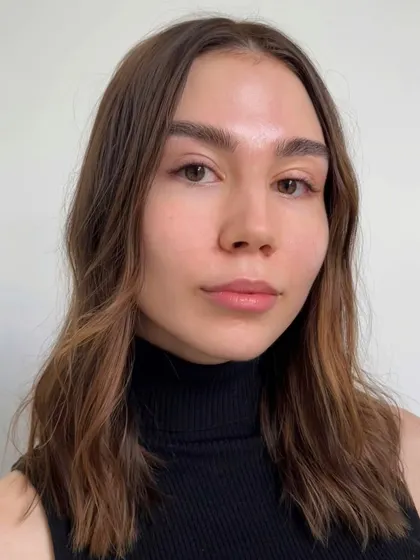 A slightly different angle of the same classic dark brown extensions. The result is subtle, elegant, and enhances her natural beauty without being obvious.
