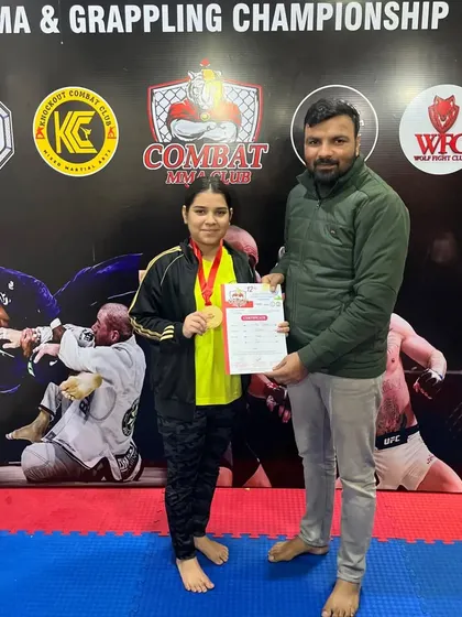 I am proud to stand with one of our young champions after her victory at the Inter-club MMA & Grappling Championship. Her gold medal is a result of her hard work and dedication. This is what our training can achieve.