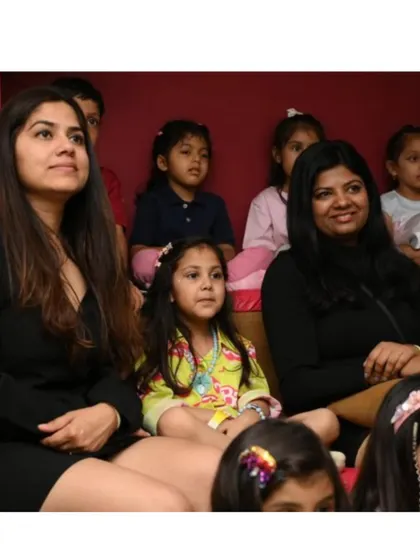 Parents and kids watching the entertainment together.