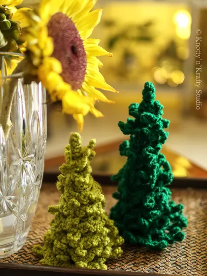 A closer look at my textured crochet Christmas trees. The different stitches give each one a unique character, just like real trees in a forest.