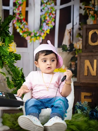 A little rockstar on the phone, maybe booking his next gig? A fun and playful shot from a musical theme.
