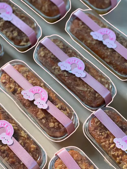 These delicious tea cakes were wrapped and decorated with a pink ribbon and an 'It's a Girl!' rainbow sticker.